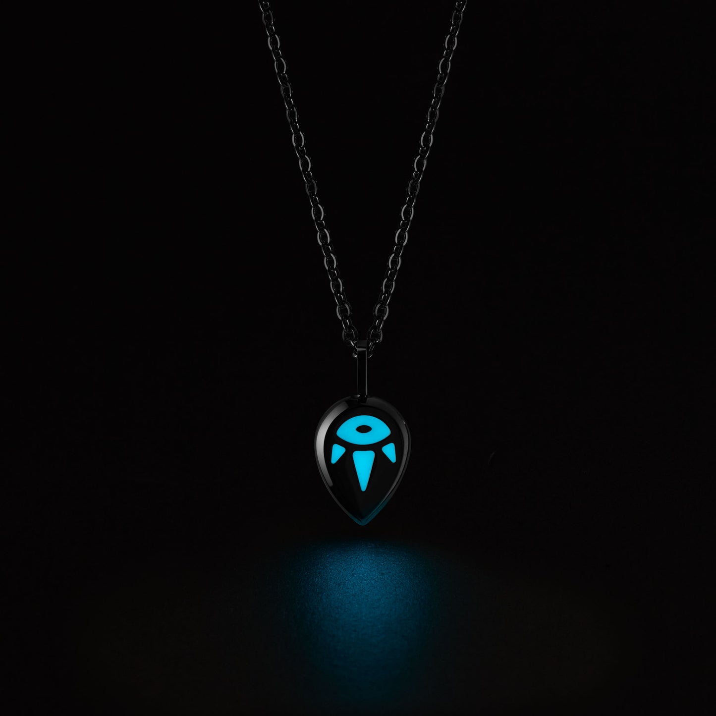 SERENE Necklace with a glowing blue pendant on a black background