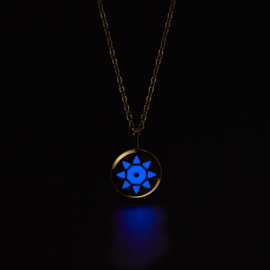 SOLIS Necklace with a pendant glowing blue in the dark