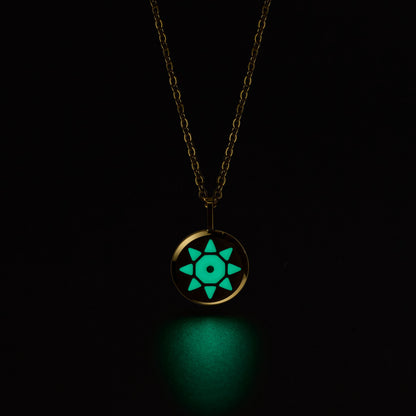 SOLIS Necklace with a glowing pendant on a black background