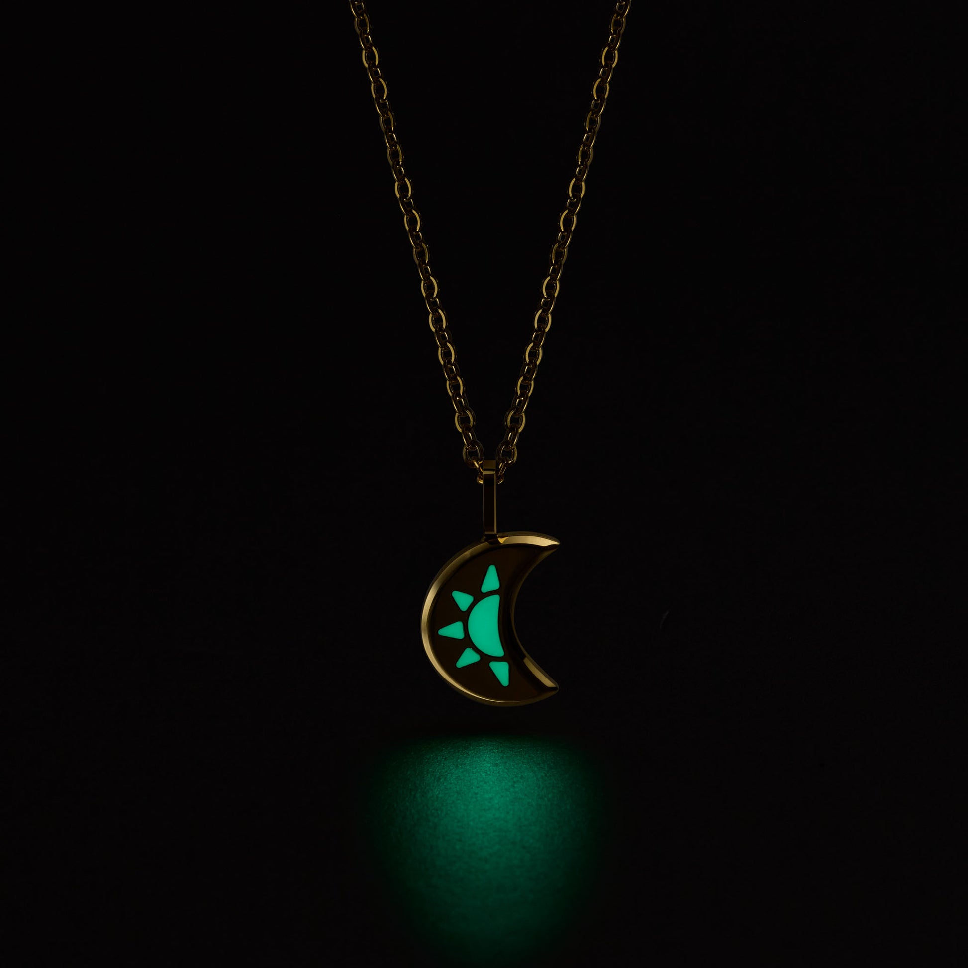 LUNA Necklace with a glowing green moon pendant on a black background