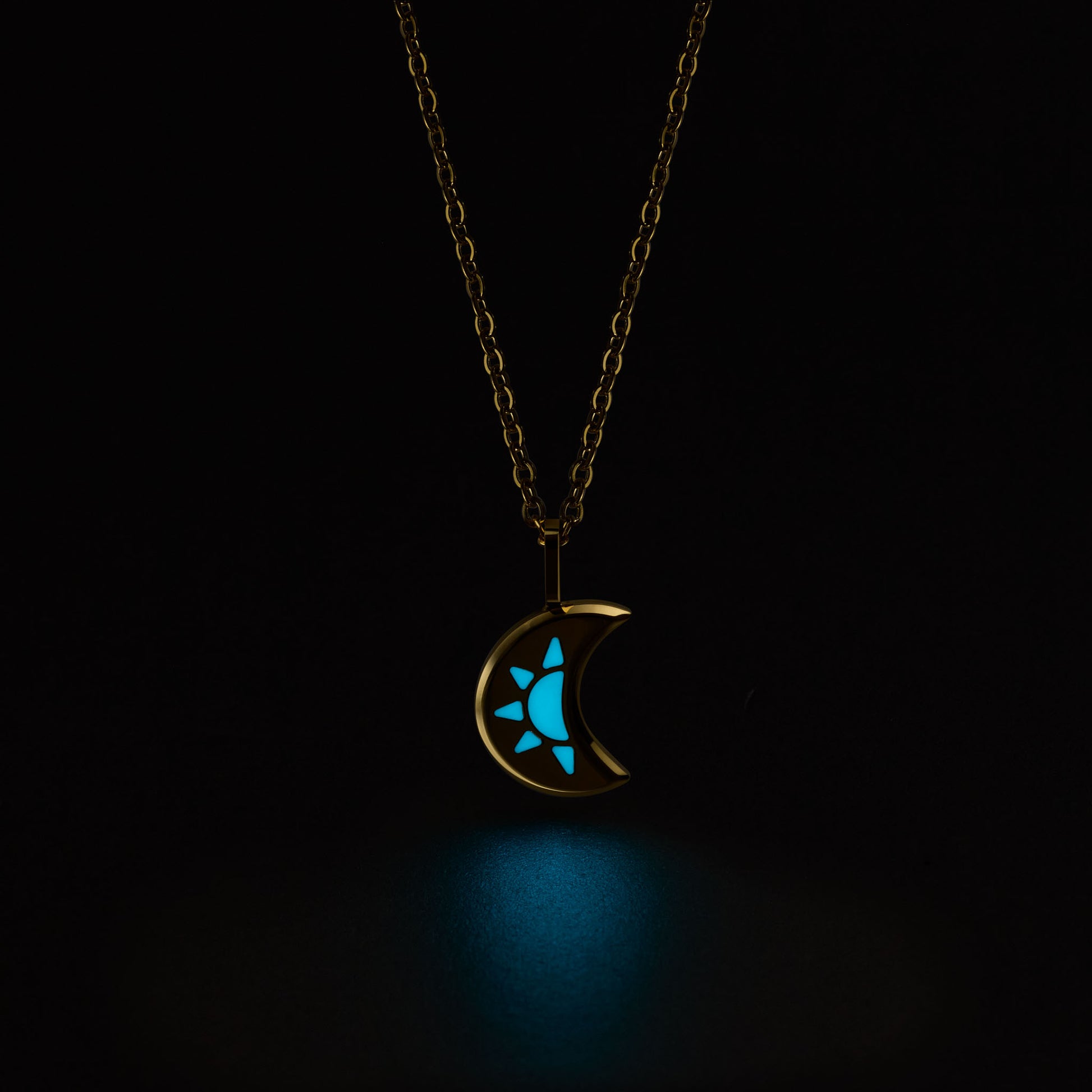 LUNA Necklace with a glowing blue moon and star pendant on a black background