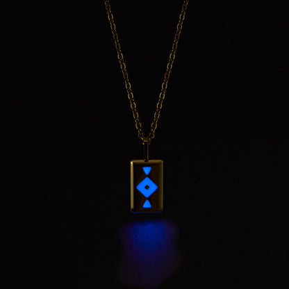 GAIA Necklace with a glowing blue pendant on a black background