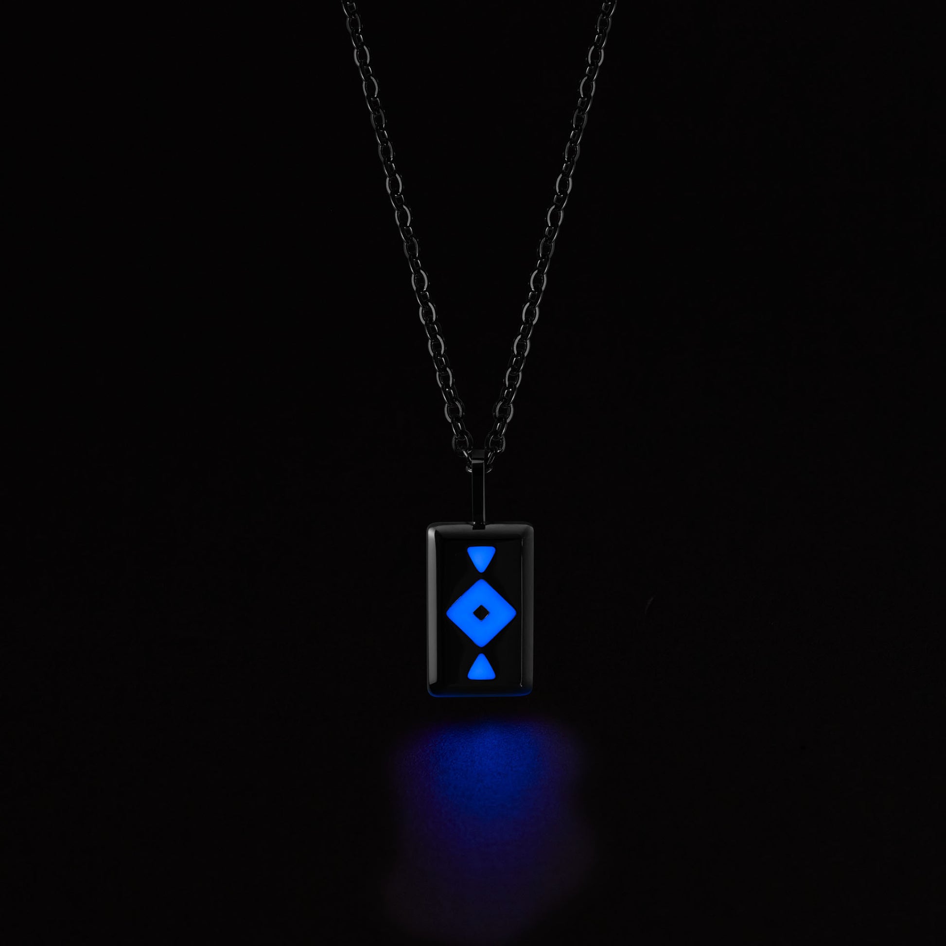 GAIA Necklace with a glowing blue pendant on a black background