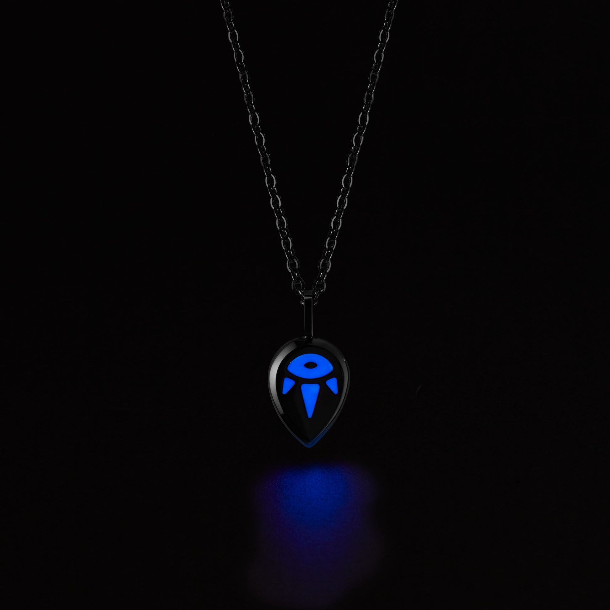 SERENE Necklace with a glowing blue pendant on a black background
